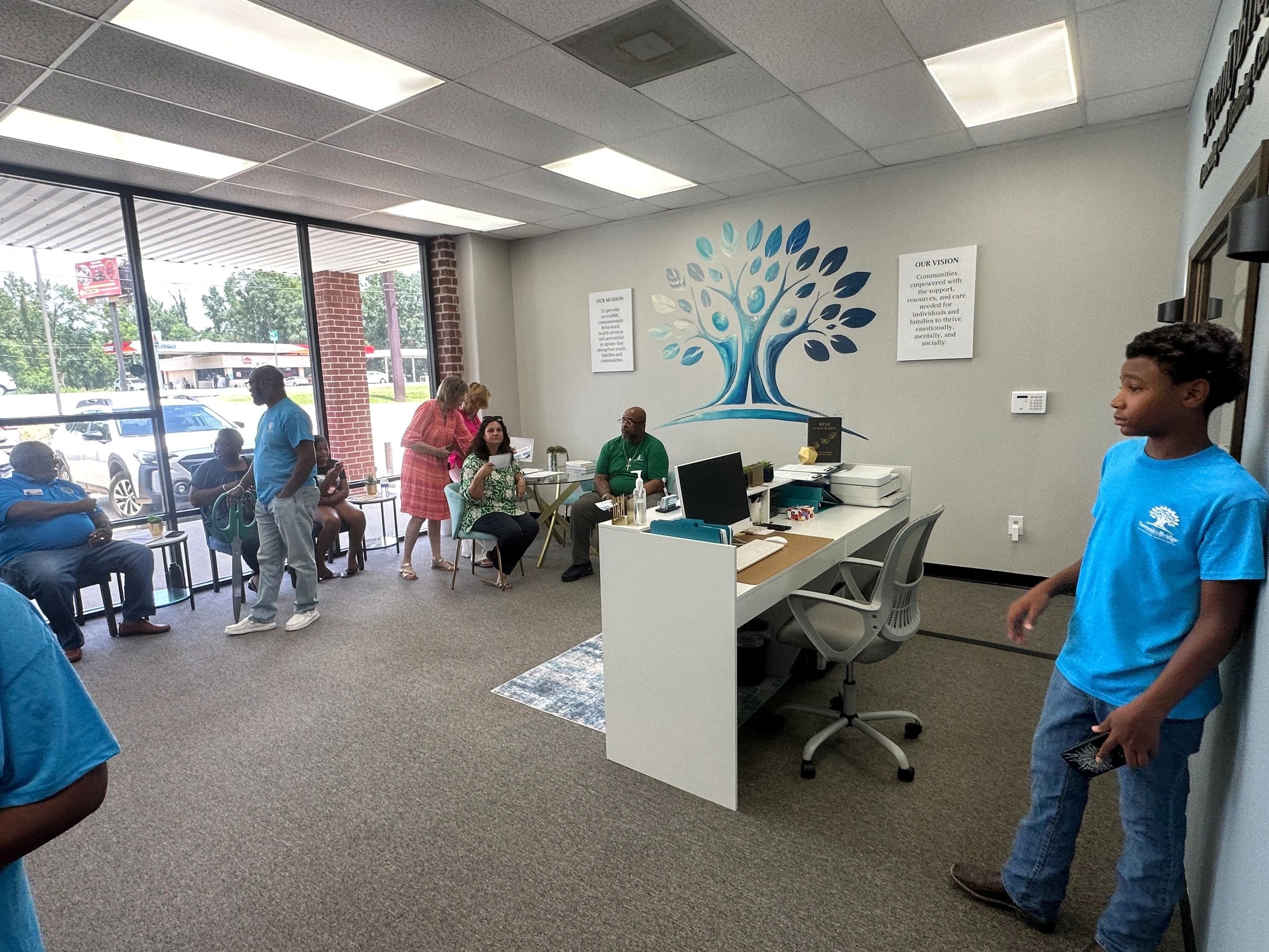 Visitors exploring the SerenityBridge center at the grand opening