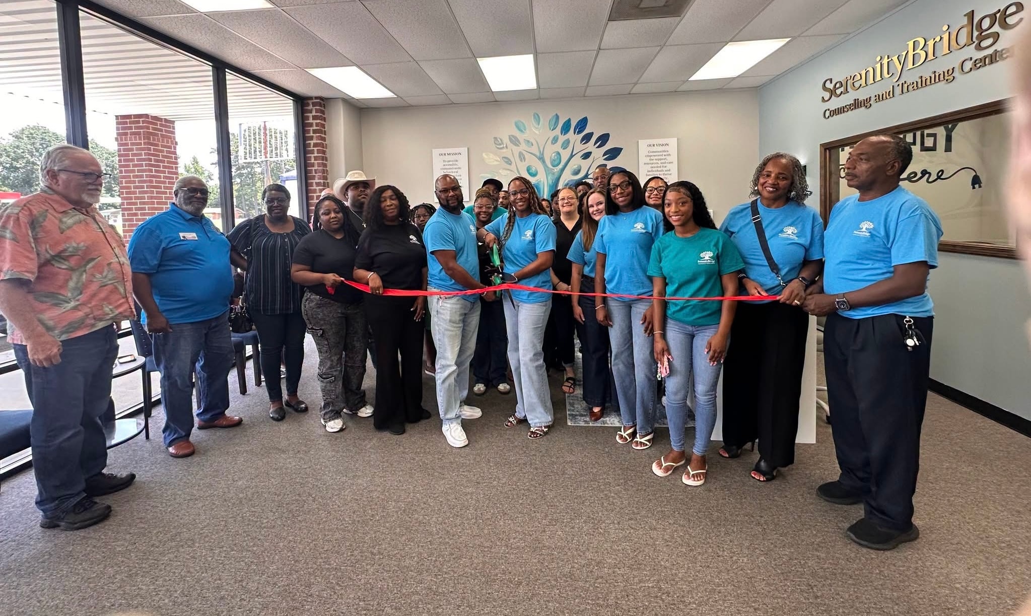 SerenityBridge team cutting the ribbon at the grand opening ceremony